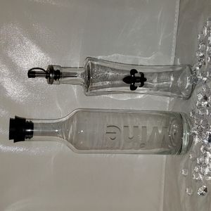 2 glass decanters.   VIVA Wine.  PALAIS Oil & Vivitar.  fleur de lis.
